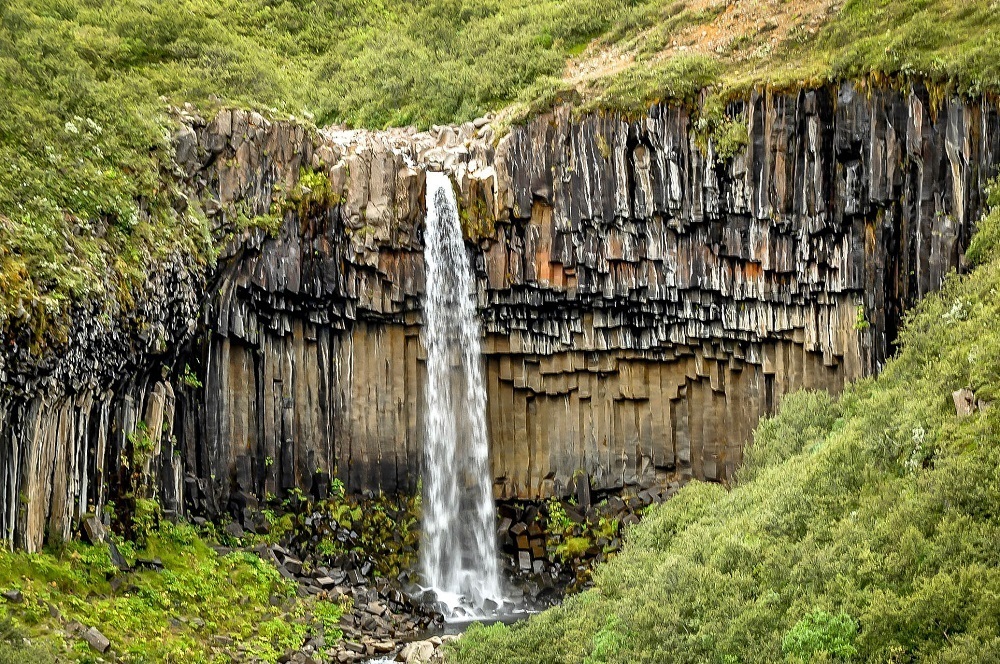 Hiking the waterfalls in Iceland, like Svartifoss.