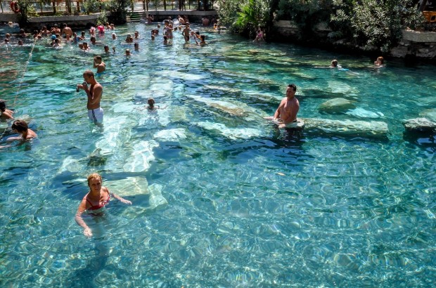 Soaking in Cleopatra’s Antique Pool at the Pamukkale Hot Springs Antique pool at Pamukkale Turkey hot springs