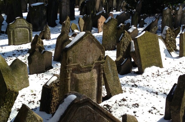 Haunted Echoes in Prague’s Jewish Quarter Haunted echos of the Prague Jewish Quarter - the tombstones show the strain of time.