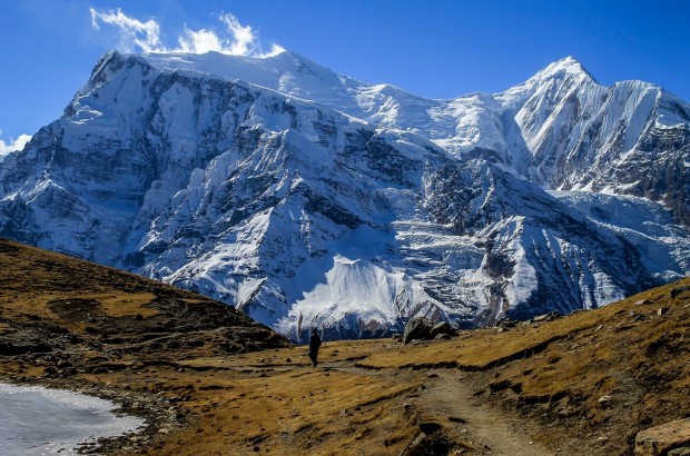 Buddhism and Bloodshed in the Nepal Civil War Man walking in the Himalayan Kingdom of Nepal near Braka