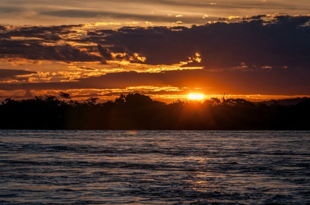 Total Relaxation at the Islands of Siankaba Sunset over the Zambezi River in Zambia.