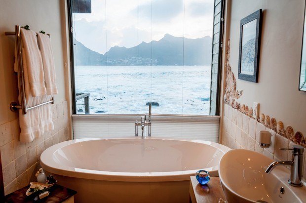 The large soaker bathtub at Tintswalo Atlantic in Table Mountain National Park in South Africa.