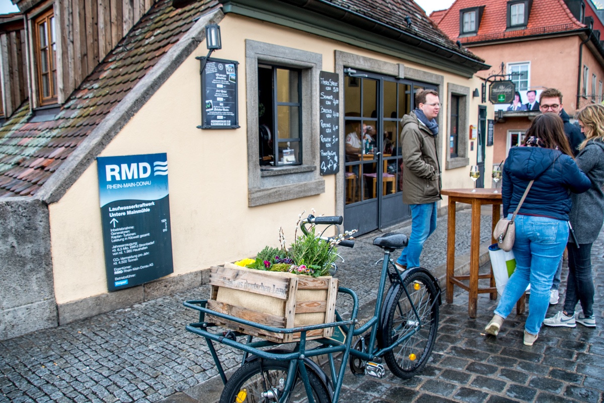 The Wurzburg wine bar window at the Restaurant Alte Mainmühle on the Alte Mainbrucke over the River Main.