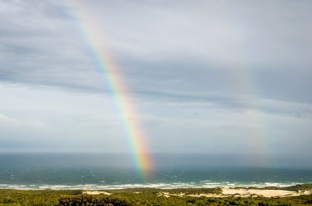 Finding Sanctuary During a Storm at the Grootbos Private Nature Reserve An unusual double rainbow over Walker Bay as viewed from the Grootbos Garden Lodge.