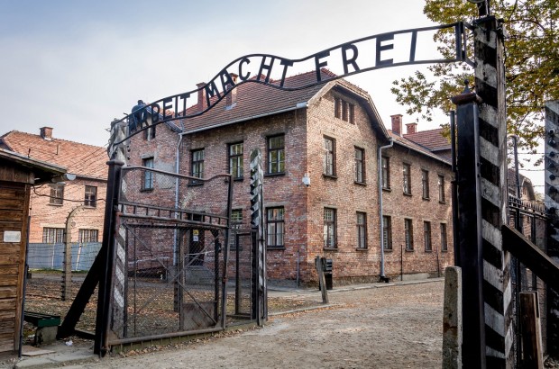 Reflecting on Humanity at Auschwitz The Arbeit Macht Frei Gate at the Auschwitz Concentration Camp and Death Camp in Poland.