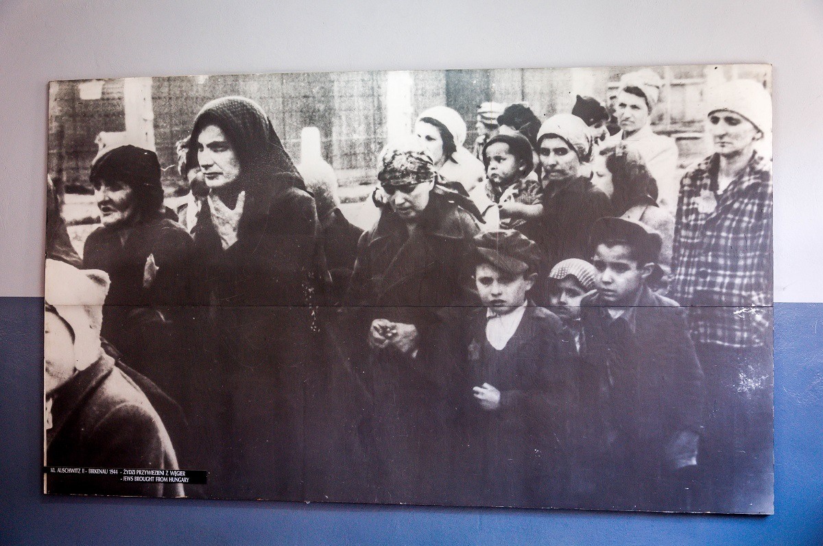 Women and children after sorting - selected to receive the gas chamber. This photo is in the museum on the Auschwitz concentration camp tour.