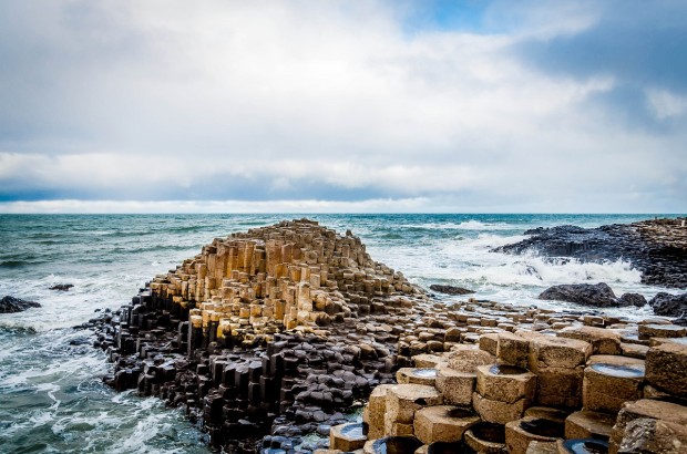 Driving the Thrilling Causeway Coastal Route The iconic basalt columns of The Giant's Causeway in Antrim, Northern Ireland. This is the highlight of the Causeway Coastal Route.