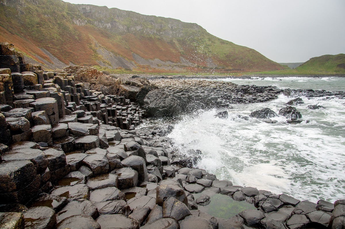 Waves crashing on the rocks at Ireland Giant Causeway
