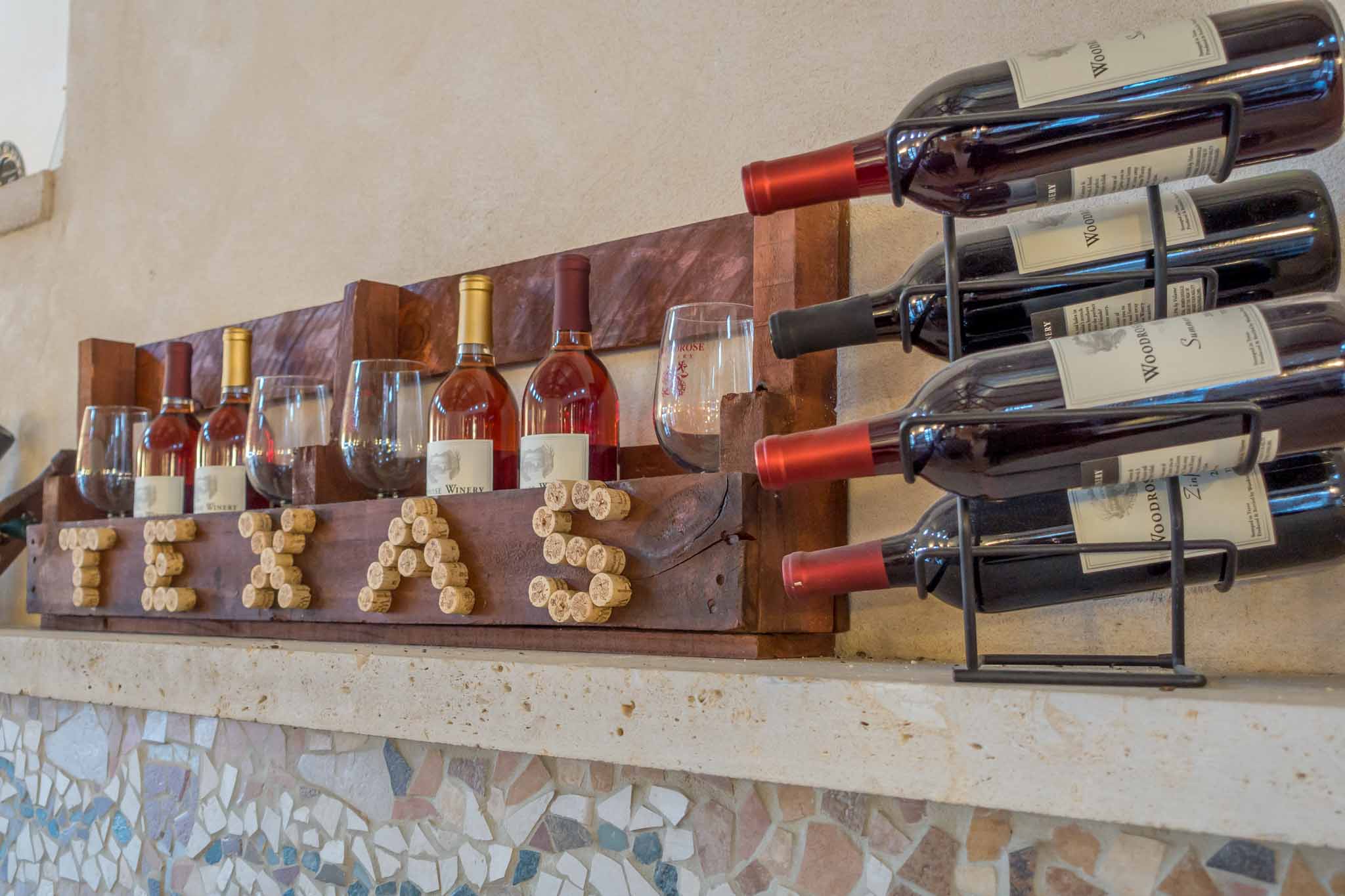 Wine display at Woodrose Winery, one of the best Texas wineries to visit in Fredericksburg