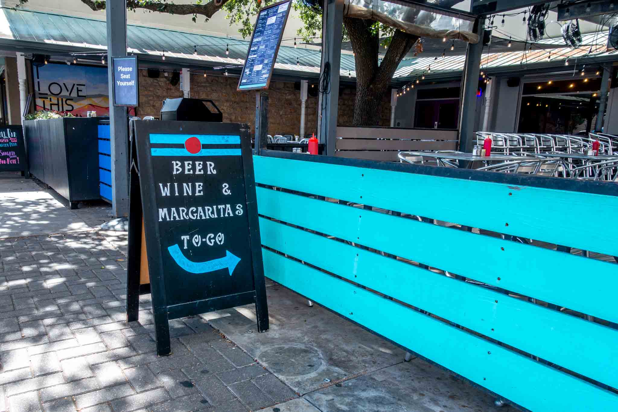 Beer, wine, margarita to go sign at Burger Burger in Fredericksburg, TX