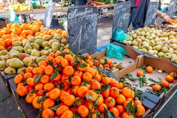 Oranges and pears for sale at the outdoor Arles market