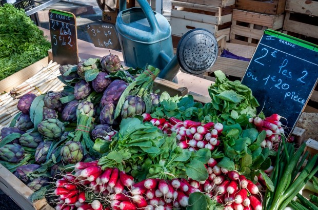 An Embarrassment of Riches — Provence Market Days Radishes and artichokes at a Provence market in Arles France