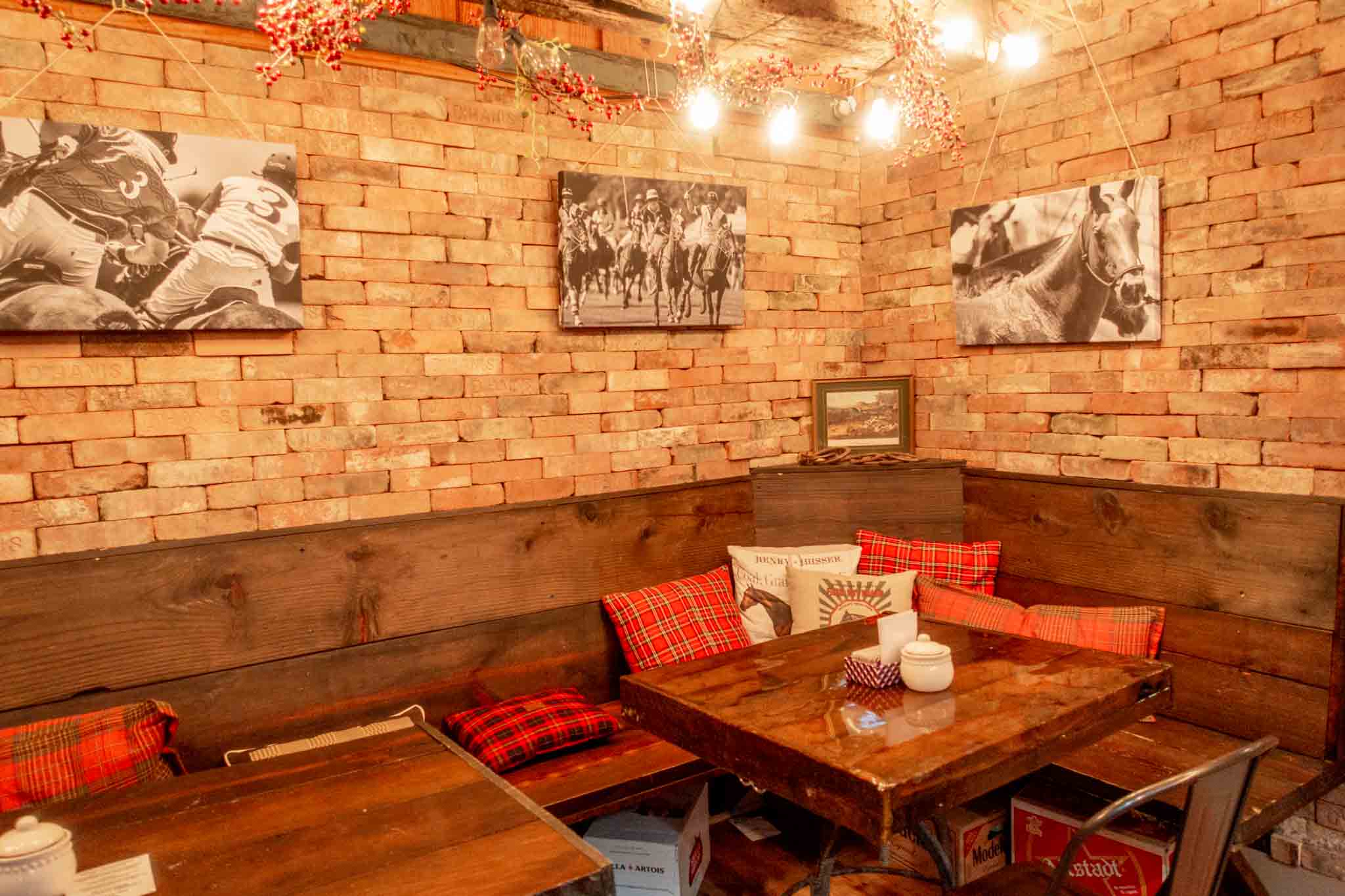 Cozy, equestrian-themed interior of The Stable Bar