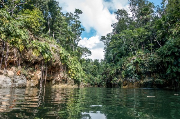 Underground Oases — An Adventurous Tour of Cenotes in Mexico Swimming through one of the cenotes near Playa del Carmen on the Xenotes Oasis Maya tour