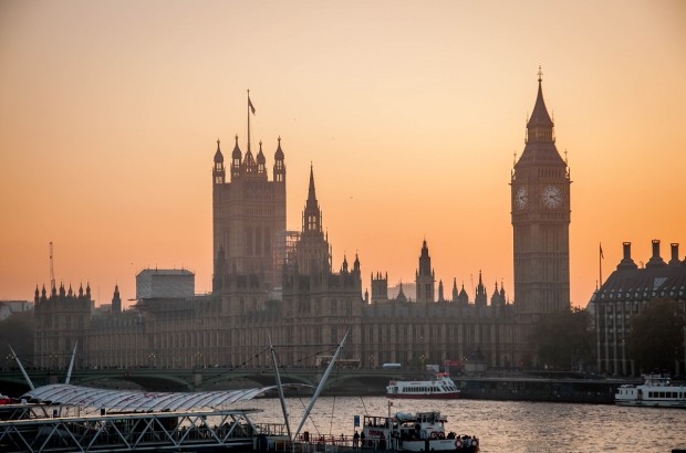 A London Walking Tour Along the Thames A view of Parliament on the Thames River on a London Walking Tour.