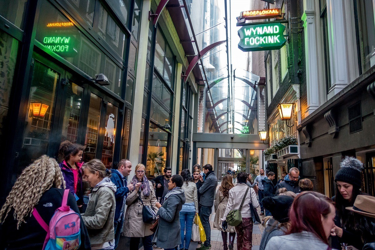 visitors enjoying genevers and liqueurs outside Wynand Fockink, a 300-year-old tasting room in Amsterdam