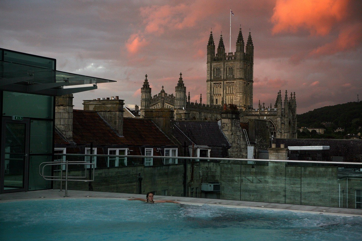 The Bath Abbey Cathedral from the Open-air Rooftop Pool at the Thermae Spa in Bath, England.