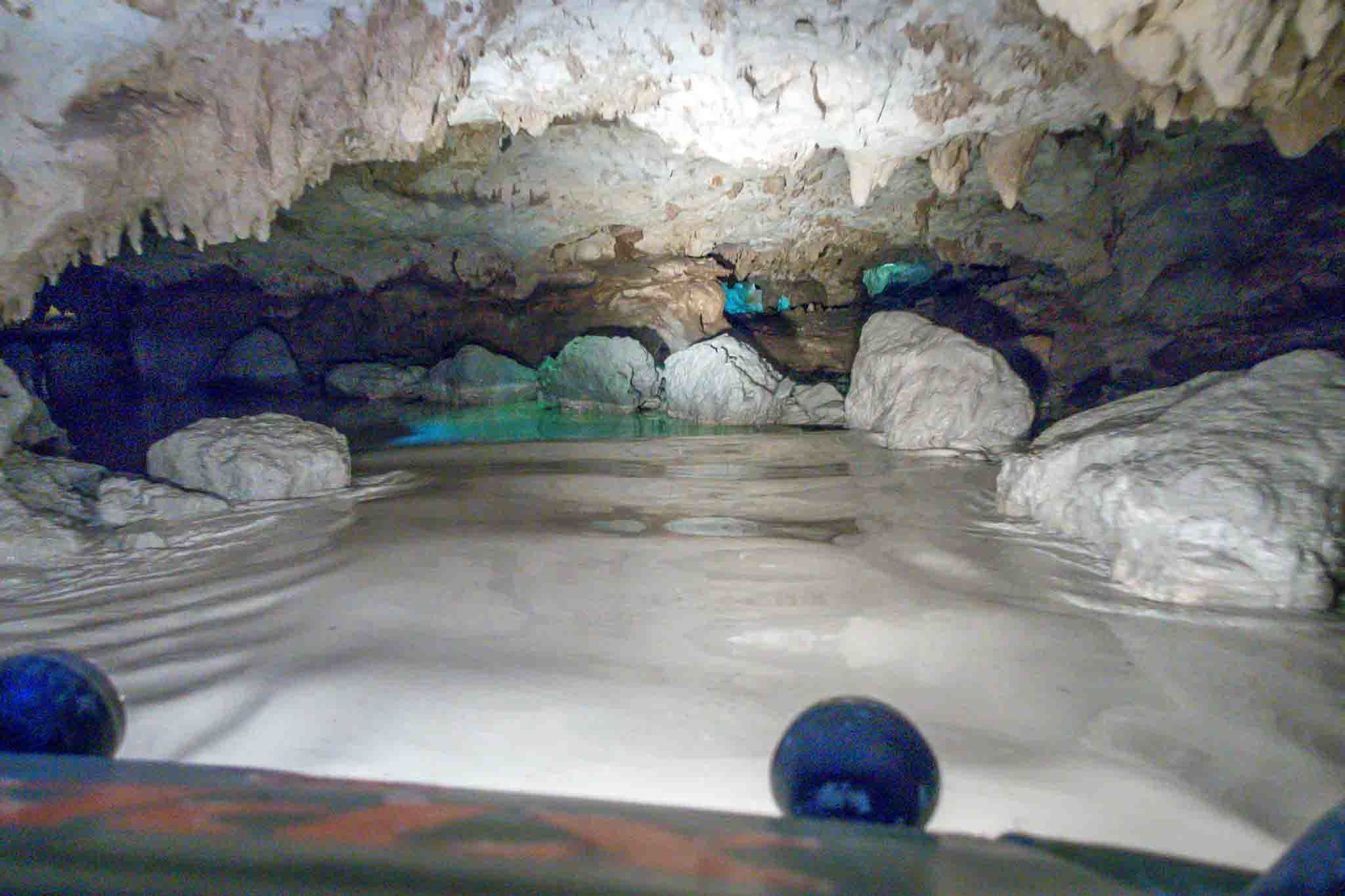 Riding in an amphibious vehicle through a flooded cave at Xplor park in Mexico