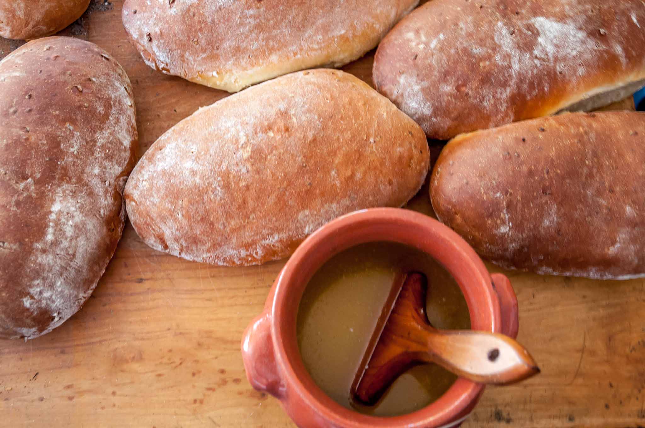 Onion bread loves and jar of melted buttered at Old Salem bakery