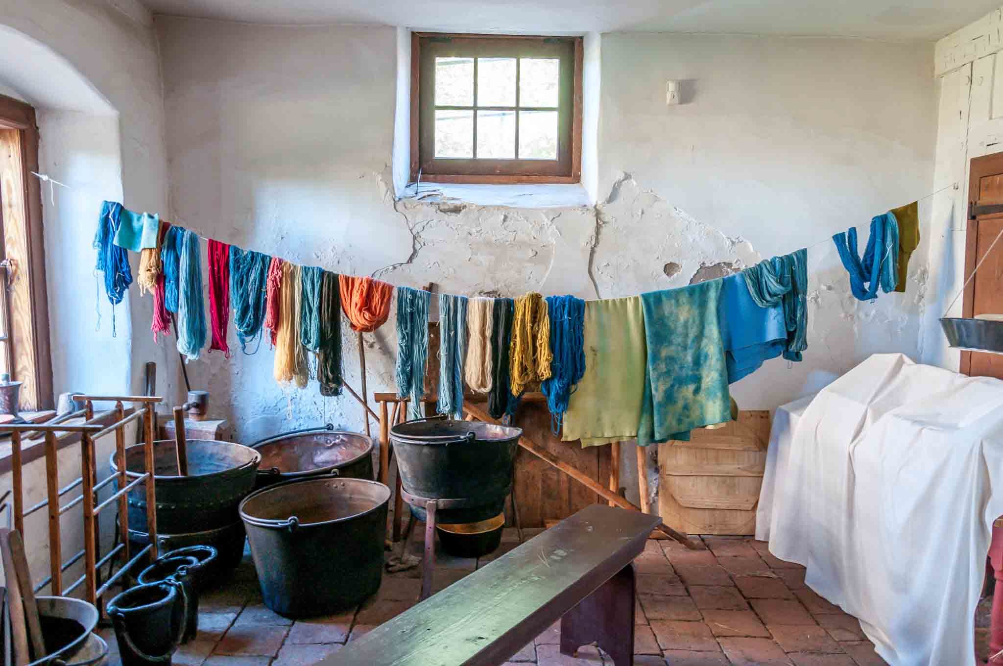 Yarn and fabric being dyed in the workshop at the Single Brothers' House