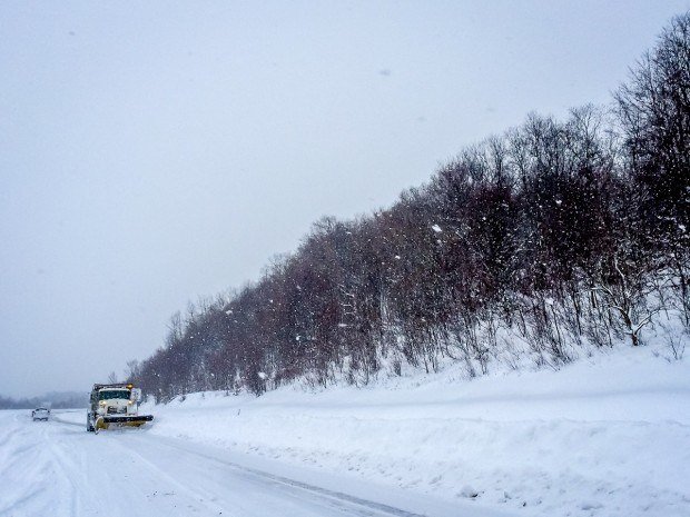 Snow plow in the January 2016 blizzard. Driving in this snow was definitely our worst travel mistake to date.