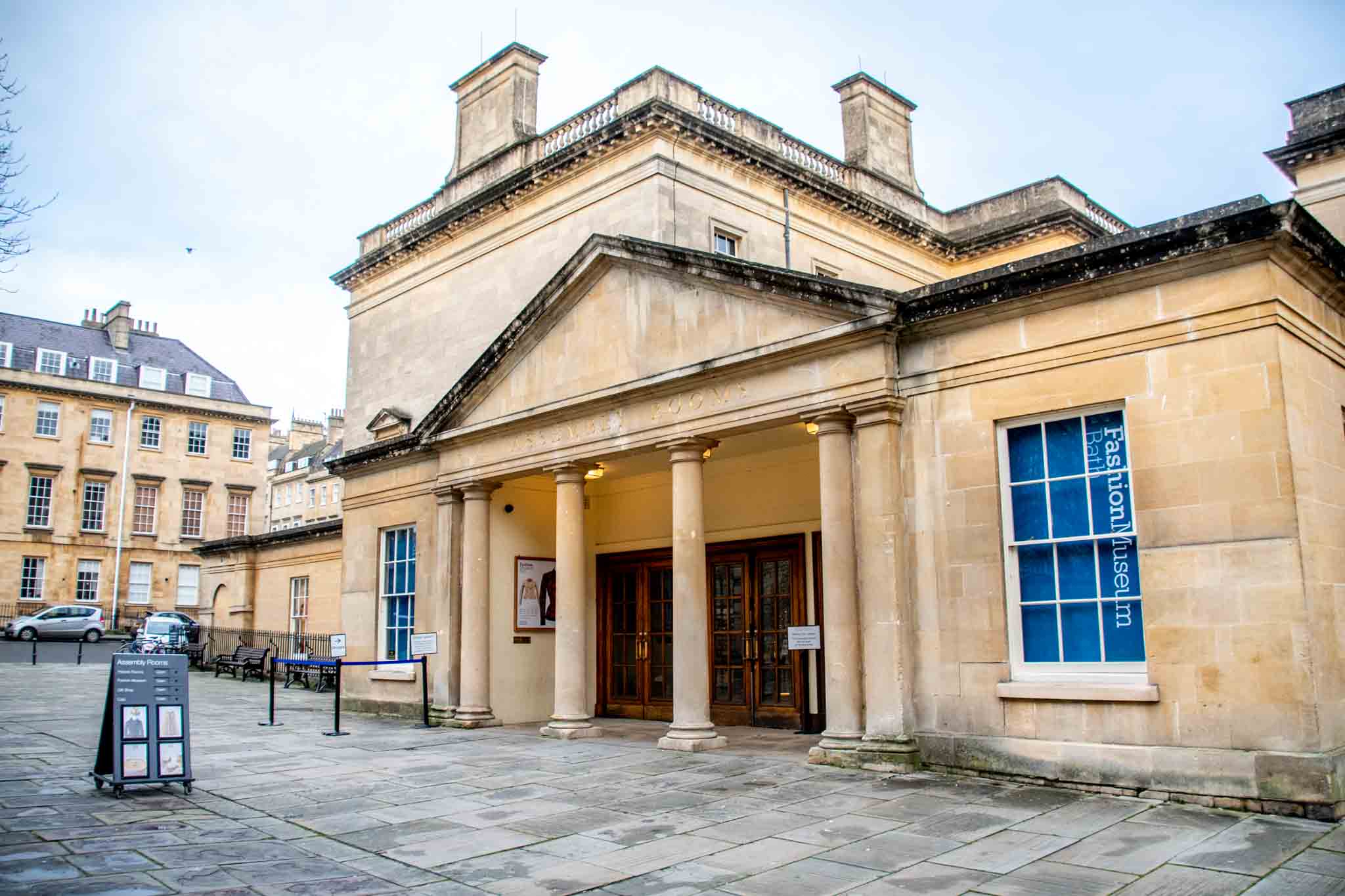 Yellow exterior of the Bath Assembly Rooms, the home of the Fashion Museum.