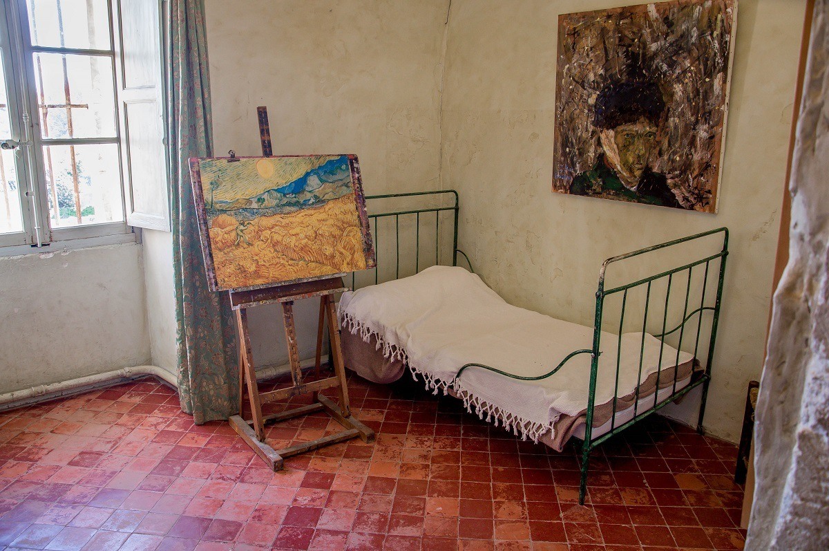 Bed and paintings in Van Gogh's room at the asylum in Saint Remy, France
