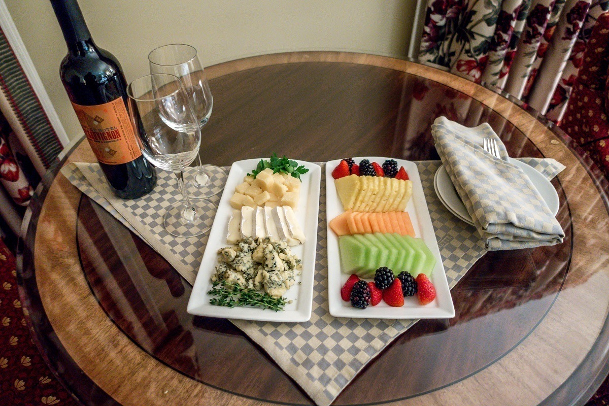 An in-room welcome gift of wine, cheese and fruit at the Hermitage Hotel.