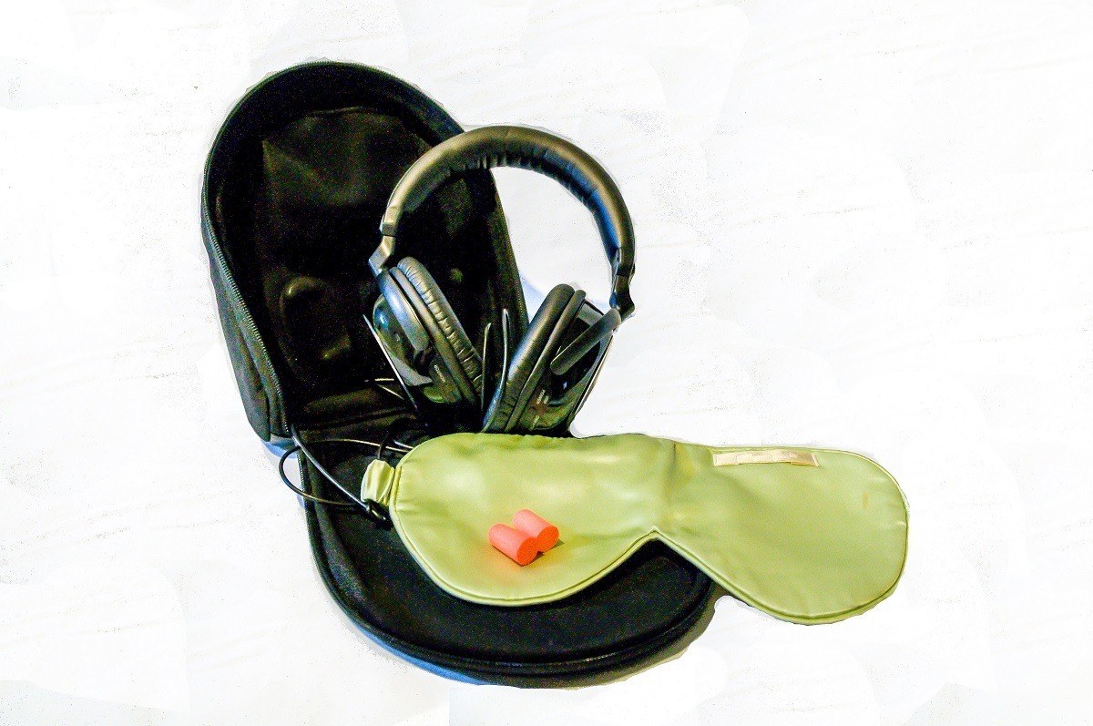 Our top three carry on essentials -- sleep mask, earplugs, and noise cancelling headphones