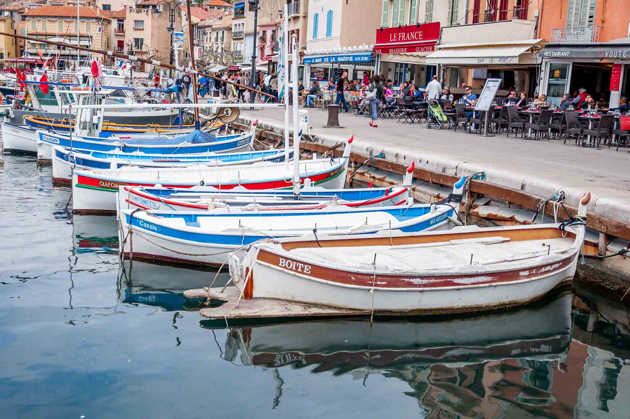 Boats and seaside restaurants in Cassis, a lovely stop on a 10-day South of France itinerary