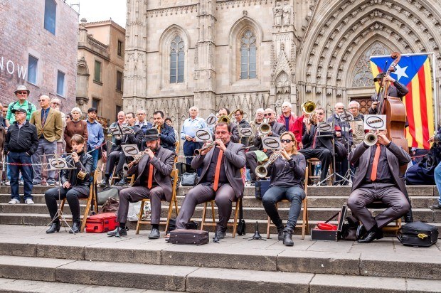 Musicians accompanying the Sardana dance on the steps of Barcelona Cathedral