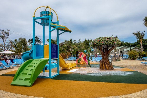 Enjoying the children's play area by the pool is one of the fun things to do in Amber Cove