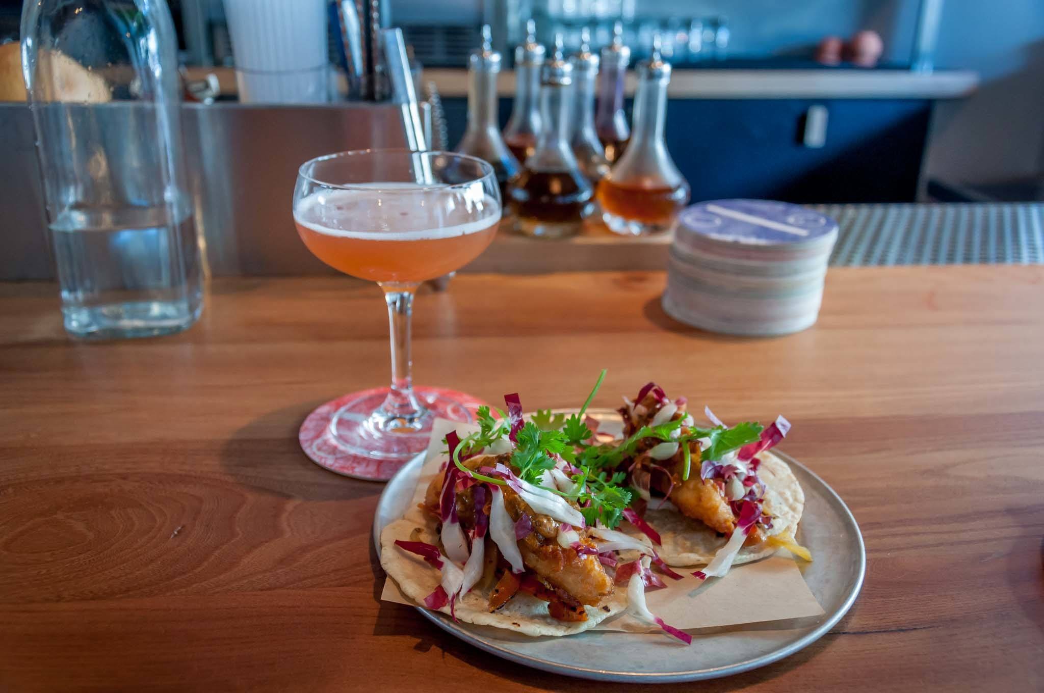 Cocktail and fish tacos at ABV