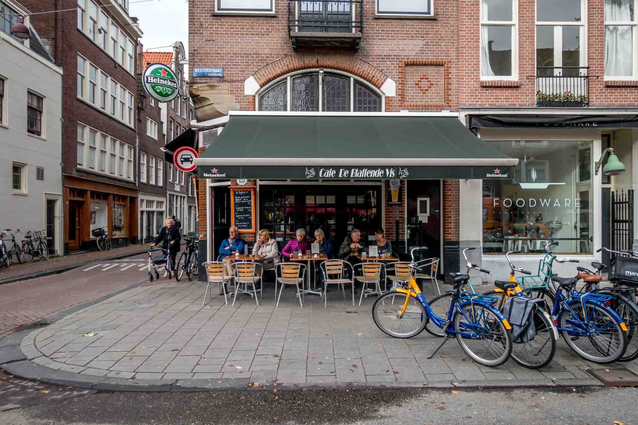 People sitting outside restaurant in the Jordaan neighborhood