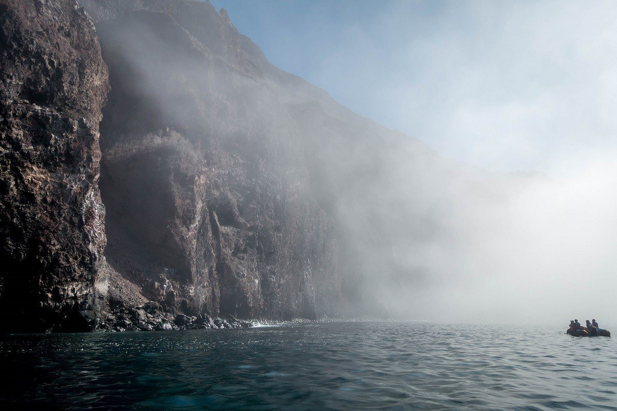 Dinghy and cliffs in the Galapagos Islands at Punta Vicente Roca