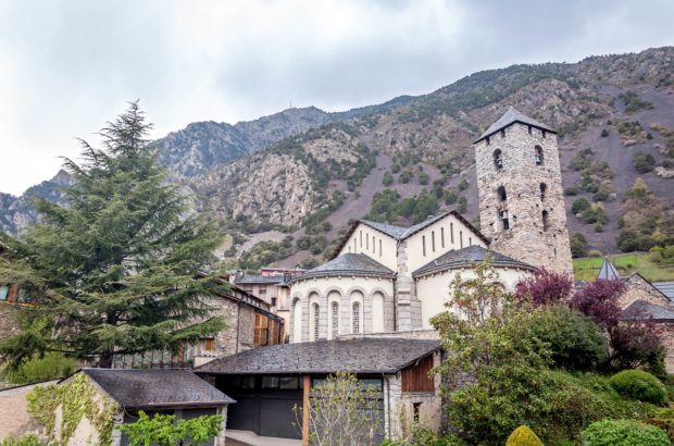 A Weekend Getaway in Andorra The church in Andorra la Vella with the Pyrenees Mountains towering above.