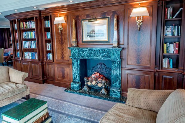 The library on Fathom cruise's Adonia ship