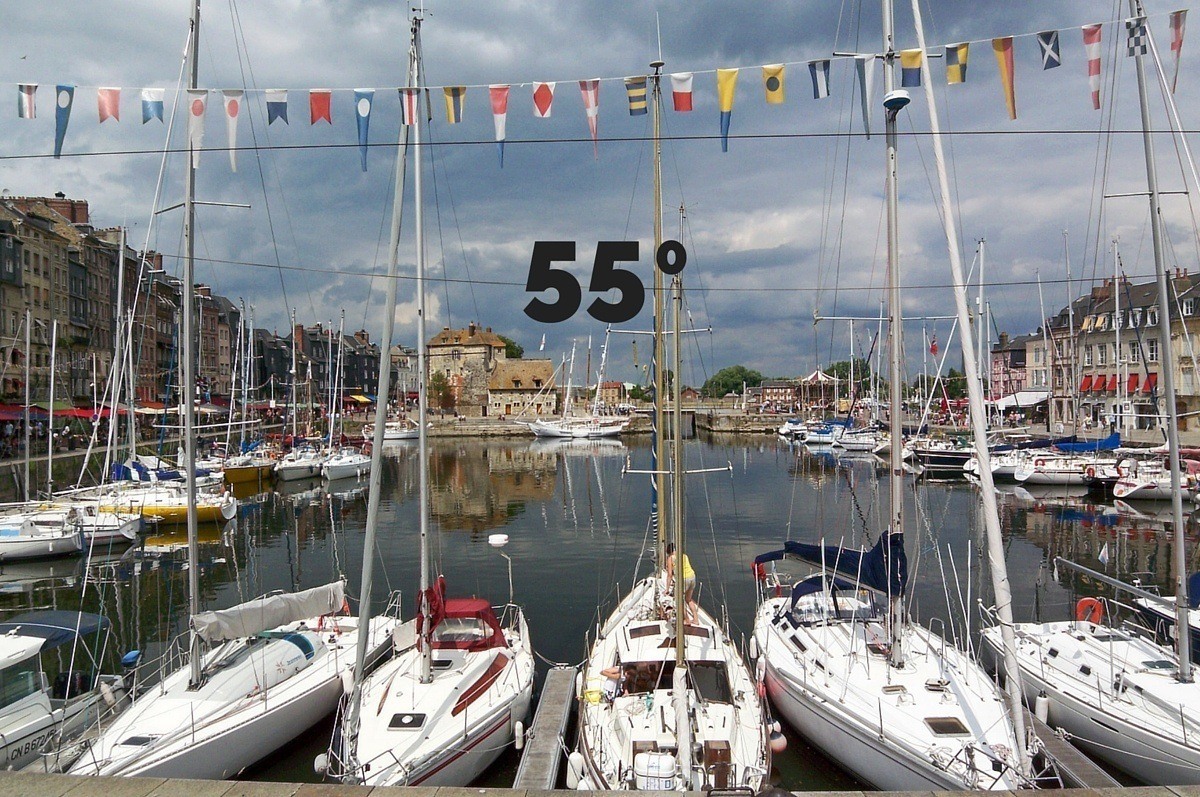"55 degrees" superimposed over boats in a harbor