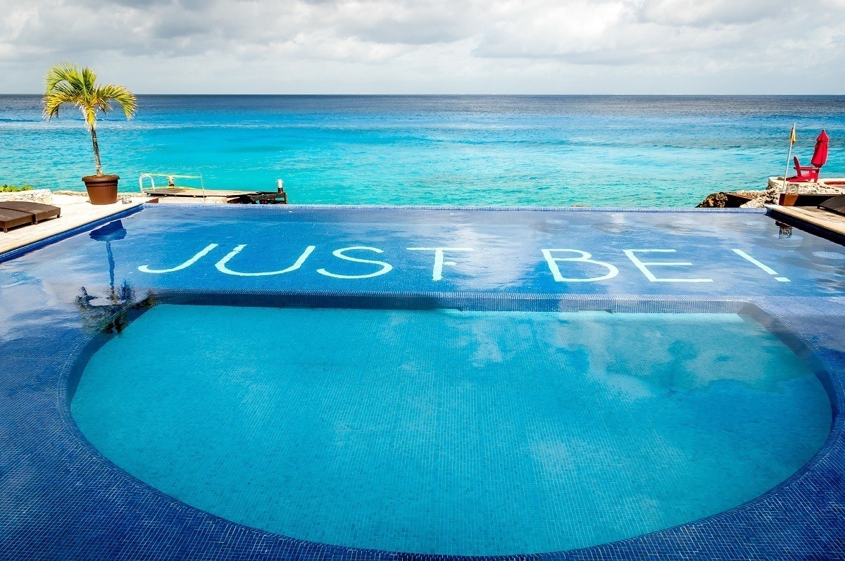 The motto on the bottom of the Hotel B Cozumel pool is "Just Be!"