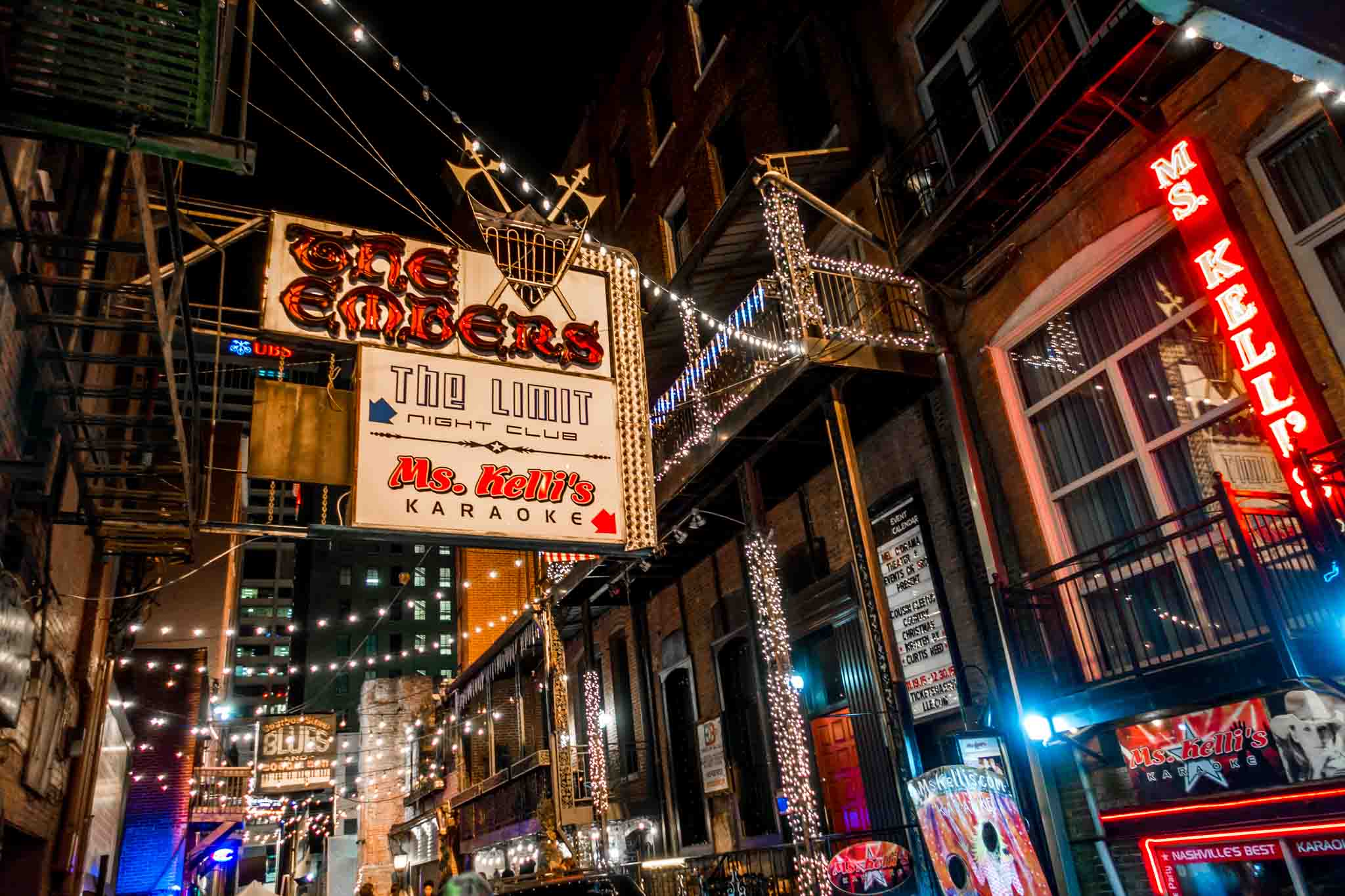 Signs advertising clubs and restaurants in Printers Alley