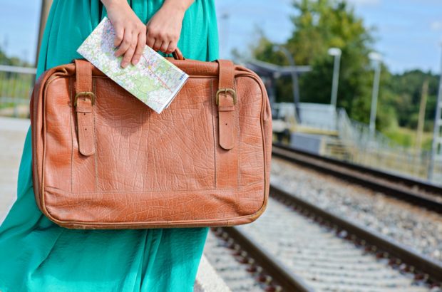 15 Packing Tips for Stress-Free Travel Woman waiting for the train