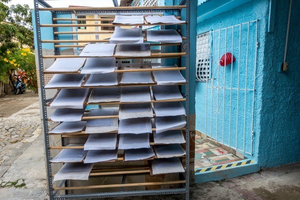 Recycled paper drying on racks in the Dominican Republic