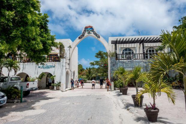 The main entrance gate to Akumal, Mexico. Head through the gate to the Akumal snorkeling paradise!