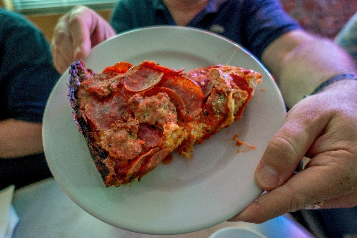Pan pizza with a caramelized crust is the specialty at Pequod's. This is just one of the pizzas you can try on a Chicago pizza tour