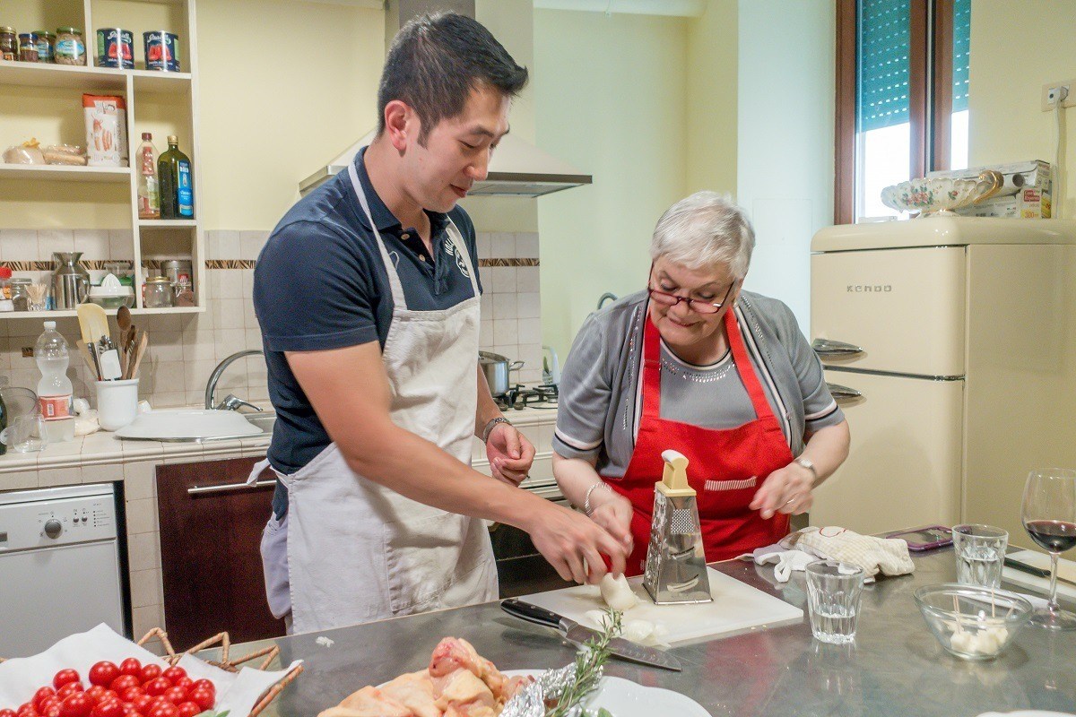 Grating onion during Cooking with Nonna, a fabulous cooking class in Rome, Italy