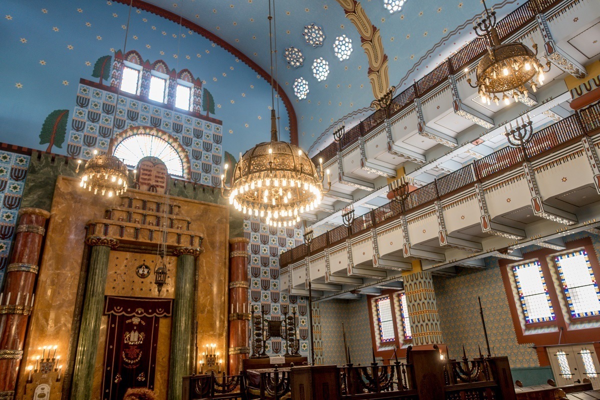 Graphic designs and chandeliers inside Kazinczy Street Synagogue