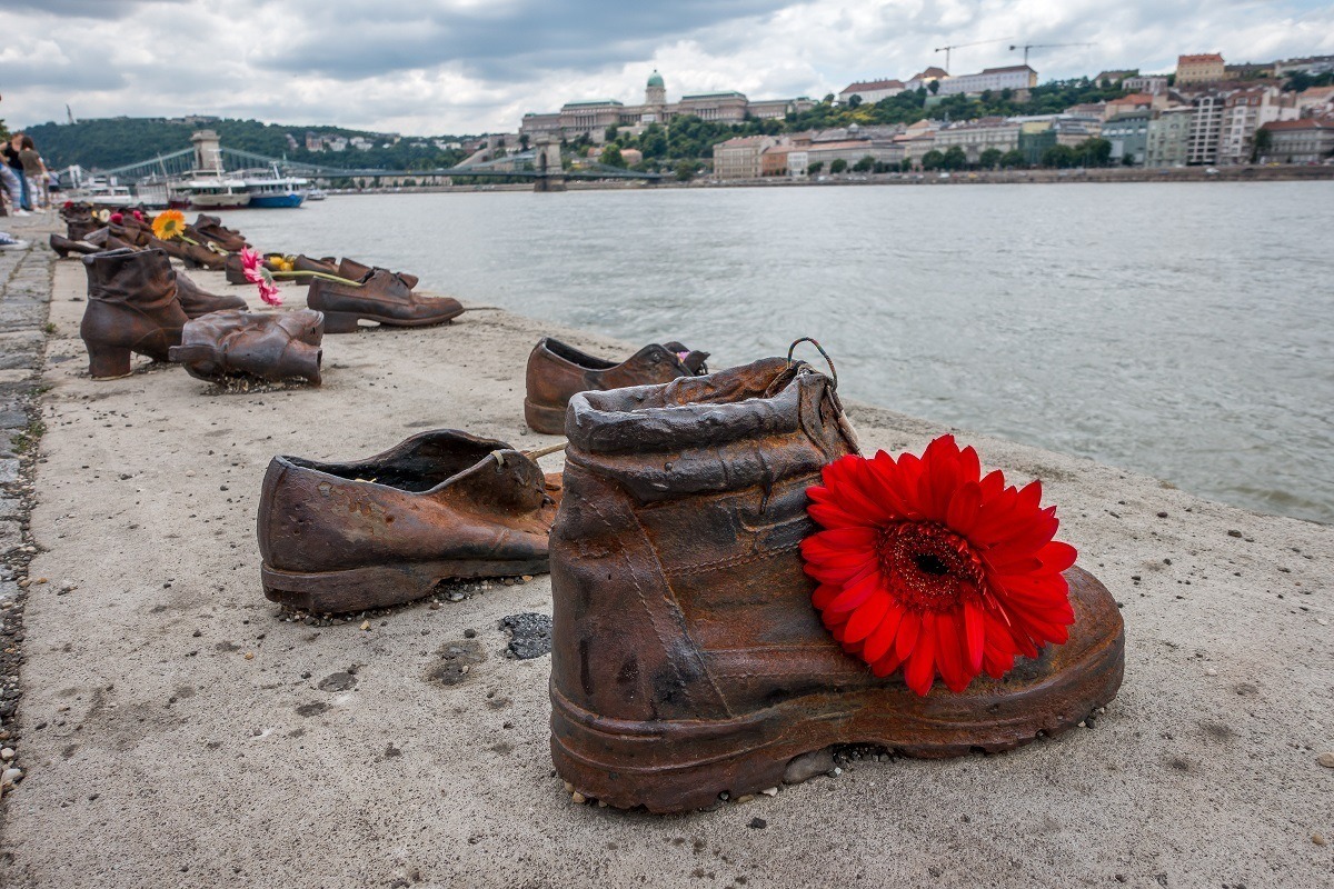 Flowers at at Shoes on the Danube memorial in tribute to Holocaust victims