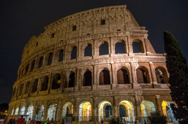 Going Underground on a Night Tour of the Colosseum Rome's Colosseum lit up at night. A night tour lets you visit exclusive parts of the ancient building.