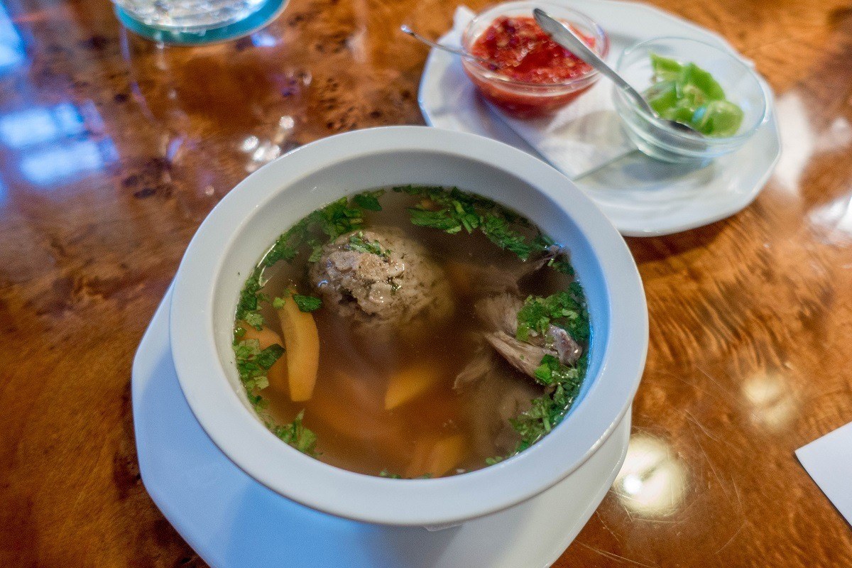 Goose matzo ball soup in a bowl