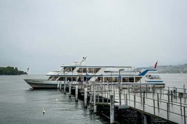 The boats on Lake Zurich take visitors for a cruise of mountain views.